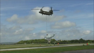 RAF Chinook lifting Royal Navy Sea King Helicopter Air Frame