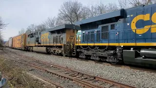 CSX M421 and CSX X217 passing each other.