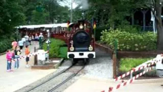 Red train departing tweedside station Busch Gardens Williamsburg Va