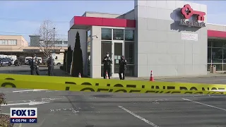 Bank employee shot during robbery; Seattle police searching for armed suspect