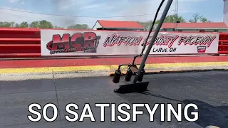 Scraping rubber off of a dragstrip