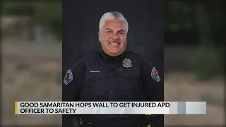 Good Samaritan hops wall, helps injured officer to safety after shooting