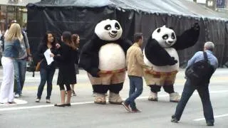 Two panda characters dance at the Kung Fu Panda 2 Premiere