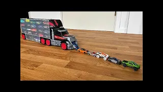 36 type Tomica Cars sliding down from big red truck Transporter - 4K Video