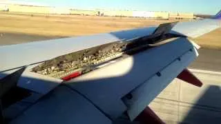 Boeing 737 Series 700 Landing - Over Right Wing - Flaps and Reverse Thrust