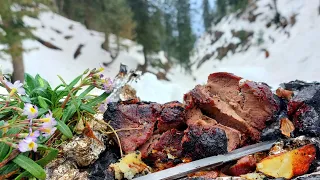 There is no more tender meat! Juicy steak cooked in foil over a campfire in deep snow. Amazing dish