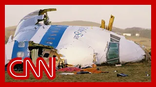 1988 footage shows Pan Am Flight 103 wreckage. The bombing suspect is now in US custody