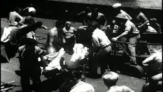 Survivors from USS Indianapolis on raft rescued by crew of USS Register at sea in...HD Stock Footage