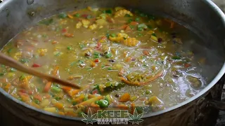 Rastafari elder cooking ital stew.