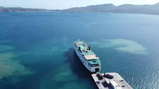 Raw Drone footage of a ferry at the port-of-Adamantas in Greece
