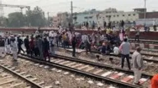 Protesting Indian farmers blockade railroad tracks