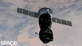 Crewed Soyuz spacecraft docks with space station in time-lapse video