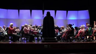 Darth Vader conducts the Imperial March when the Central Garrison invades the Rochester Symphony.