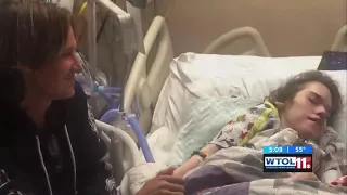 Country star Keith Urban takes time for a fan in a Toledo hospital before his concert