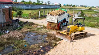 First new project!! land filling in village using bulldozer pushing soil and 5ton truck loading soil