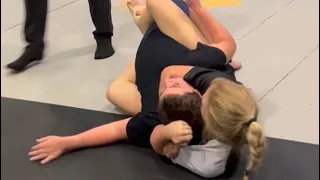 Kylie quickly takes out a wrestler by Rear Naked Choke!