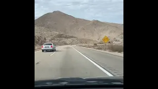 Time lapse drive in California mountains down to valley floor. Interstate Eight East