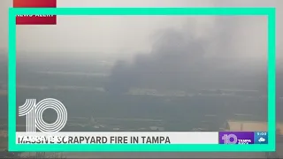 Firefighters battle a scrapyard fire in Tampa