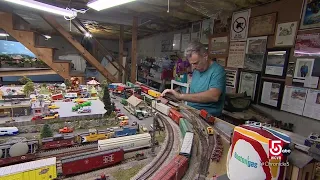 An elaborate scale model railroad layout chugs its engine in a Leominster, Mass. home