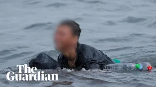 Migrant boy swims to beach in Spain's Ceuta with plastic bottles to stay afloat