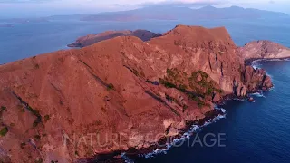 Drone footage of Komodo National Park, Indonesia with the south of Padar Island at sunset and its...