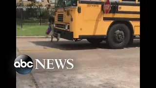 Car blows past school bus stop sign, nearly hitting child