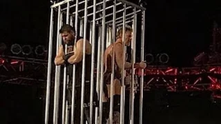 Roman Reigns & Seth Rollins Lock Kevin Owens & Chris Jericho In A Cage After WWE Raw 12/19/16