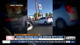 Woman bashes car window with bat during road rage incident