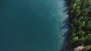 Amazing drone flight over Popradské Pleso Lake, High Tatry Mountains National Park of Slovakia