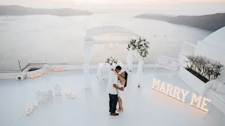 Engagement Proposal in Santorini on the whitewashed balcony | Vanilla Sky Weddings