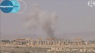 Isis in Palmyra; smoke rises over Syrian ancient ruins