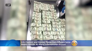 CBP Keeps Criminals From Sitting On Cash Stash After Nearly $500K Found In Chair At MIA
