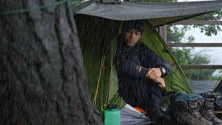 Camping in the heavy rain on a mountaintop deck