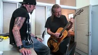 Robert Plant playing Elvis guitar at Christopher Ameruoso photo shoot