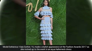 Kaia Gerber, 16, reveals her very slender waist in aqua blue frill dress as she attends the Fashion