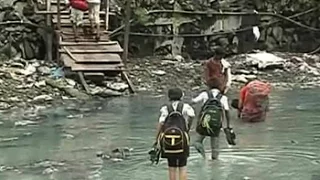 For 200 kids who walk through sewage to school, finally, a bridge