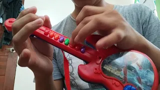 Pirates of the Caribbean song played on toy guitar