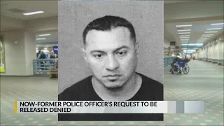 Former APD officer accused of rape to stay behind bars