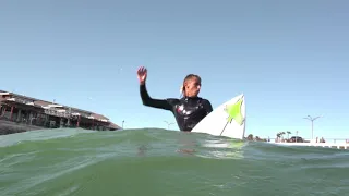 Surfing the Redondo Horseshoe Pier. By Greg Browning