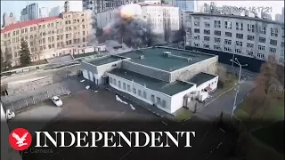 Moment Russian airstrike hits Kyiv arts centre, shattering glass next to civilian