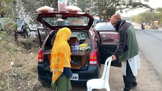 Hardworking couple selling street food from a Maruti Suzuki Alto.