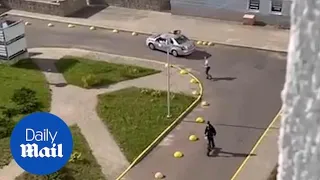 Amusing moment clever scooter rider runs rings around Minsk police car