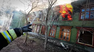 FIRE IN AN EMERGENCY HOUSE. A RESETTLED BARRACK IS ON FIRE RUSSIAN FIREFIGHTERS