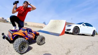 RC TRUCK JUMP OVER A TESLA.
