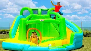 Ali and Adriana play with Inflatable water slide