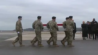 Hand over heart, Biden joins grieving families of US troops killed in Jordan as remains arrive home