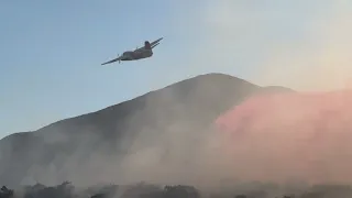 Air Tanker 72 makes a retardant drop on the Proctor Fire
