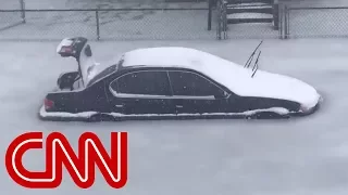 Cars trapped in frozen flood
