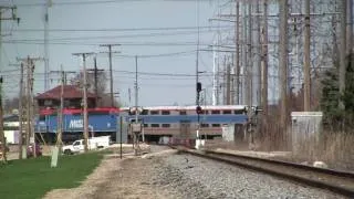 Chicago bound Metra slams the CN diamond at Deval Tower