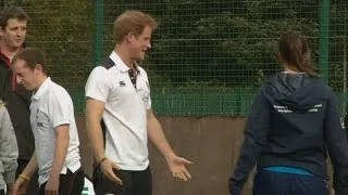 Prince Harry rugby tackles a girl at Eccles RFC